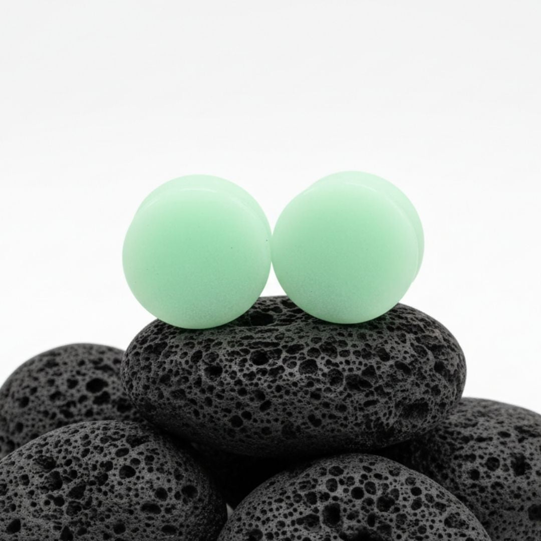 Glow In The Dark Moonstone Plugs for stretched ears, available in sizes 2G (6mm) up to 1 inch (25mm). Unique alt jewelry.