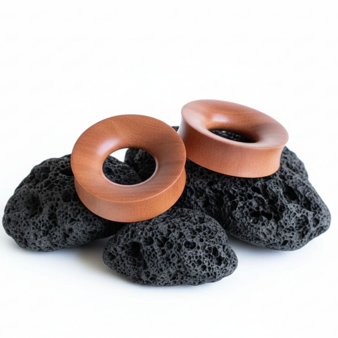 Pair of organic Saba Wood tunnels (plugs/gauges) for stretched ears, shown on a neutral background, available in sizes 6mm to 38mm.
