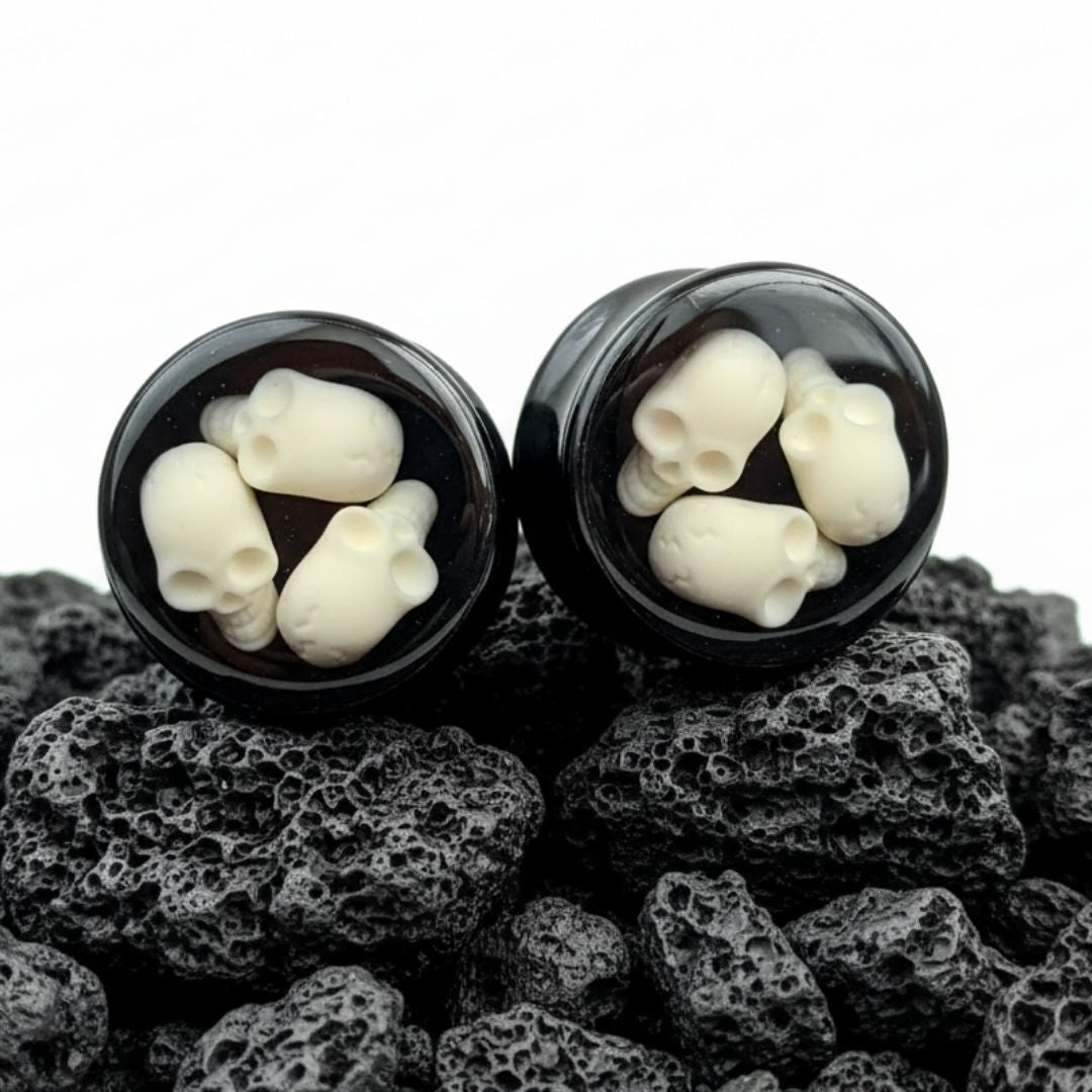Lightweight acrylic grim reaper plugs with black background for stretched ear lobes. Goth alternative gauges, 10mm to 24mm.