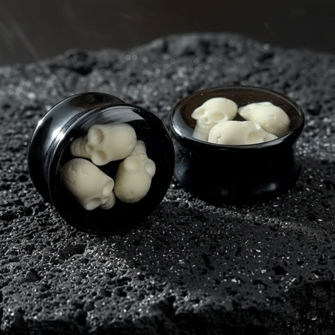 Lightweight acrylic grim reaper plugs with black background for stretched ear lobes. Goth alternative gauges, 10mm to 24mm.