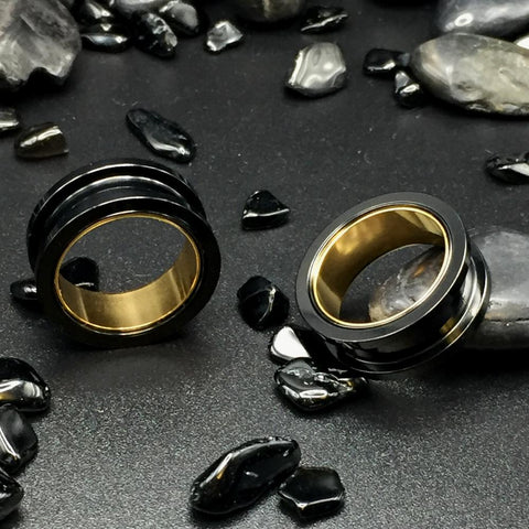 Black Steel Ear Tunnels accented with Gold