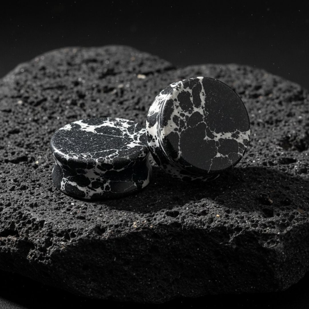 Close up photo of Black Imperial Turquoise stone plugs/gauges showing deep natural black matrix veins. Stretched ear jewelry.