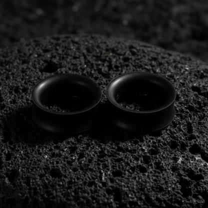 Pair of black flexible silicone tunnels (plugs/gauges) for stretched ear lobes, 4mm to 25mm
