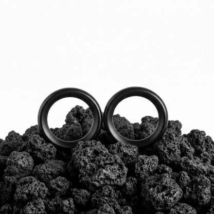 Pair of black flexible silicone tunnels (plugs/gauges) for stretched ear lobes, 4mm to 25mm