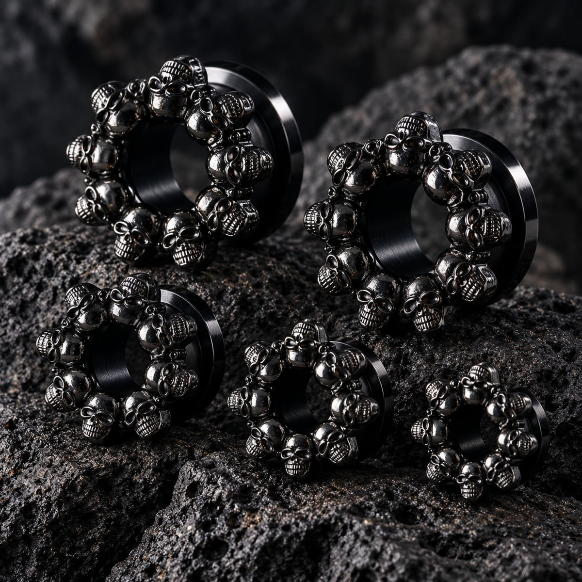 Death’s Head Steel Tunnels (6mm-16mm) on dark volcanic rock with dramatic lighting.