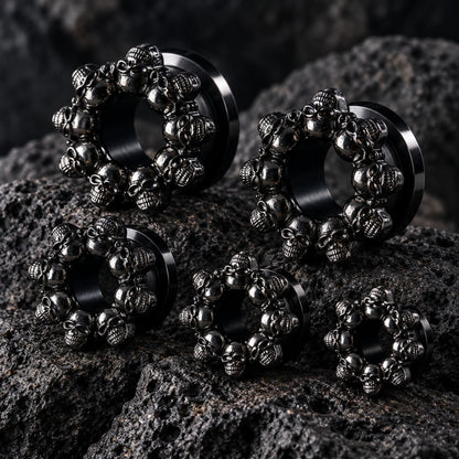 Death’s Head Steel Tunnels (6mm-16mm) on dark volcanic rock with dramatic lighting.
