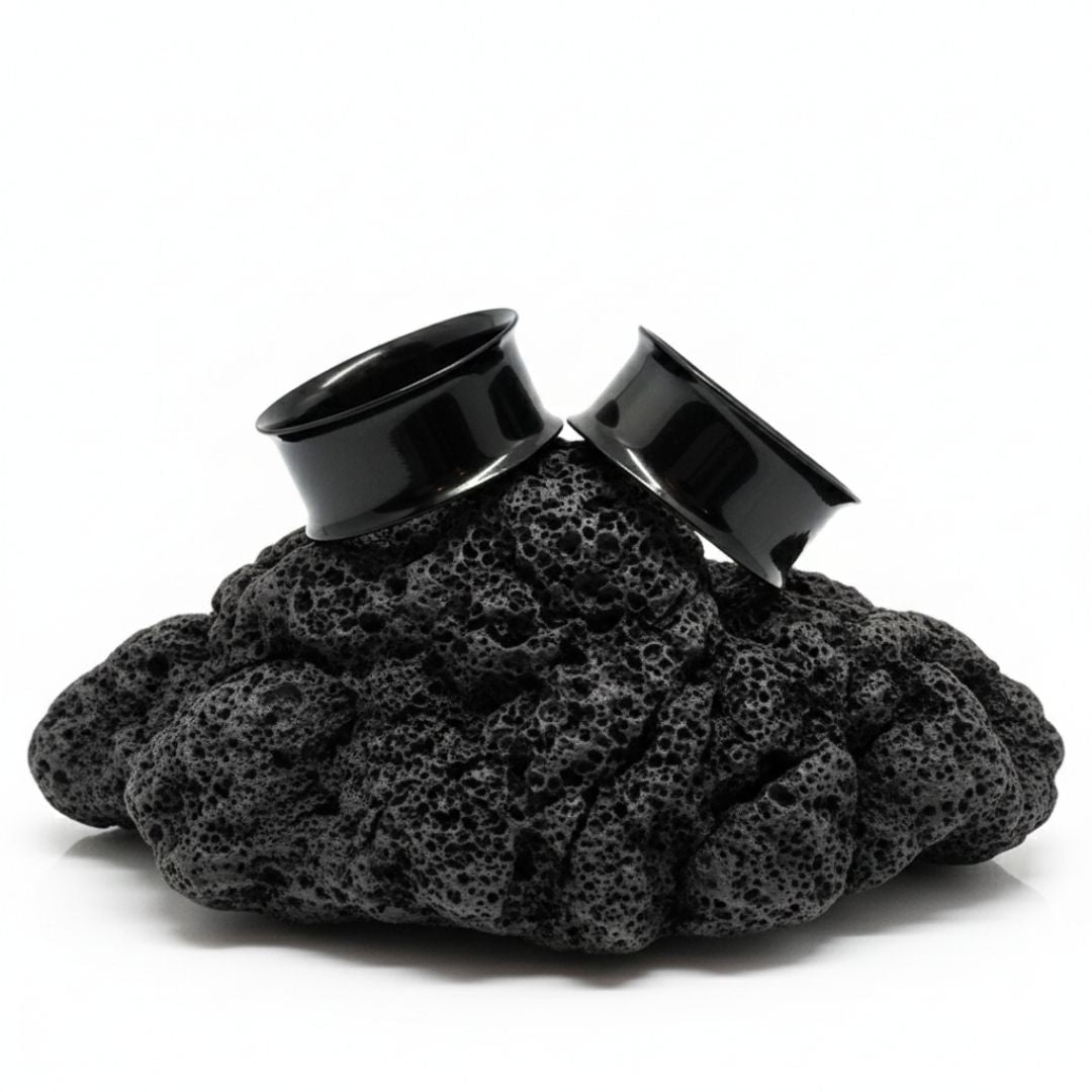 Pair of black PVD surgical steel tunnels for stretched ear lobes. Edgy alternative gauges ranging from small 12G to large 2 inch sizes.