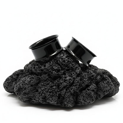 Pair of black PVD surgical steel tunnels for stretched ear lobes. Edgy alternative gauges ranging from small 12G to large 2 inch sizes.
