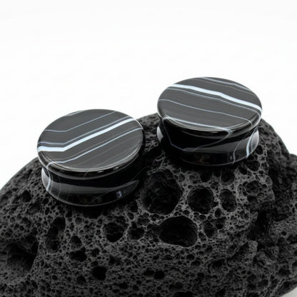 Pair of deep black striped agate stone plugs, natural double flare gauges for stretched ear piercing culture, USA stock.