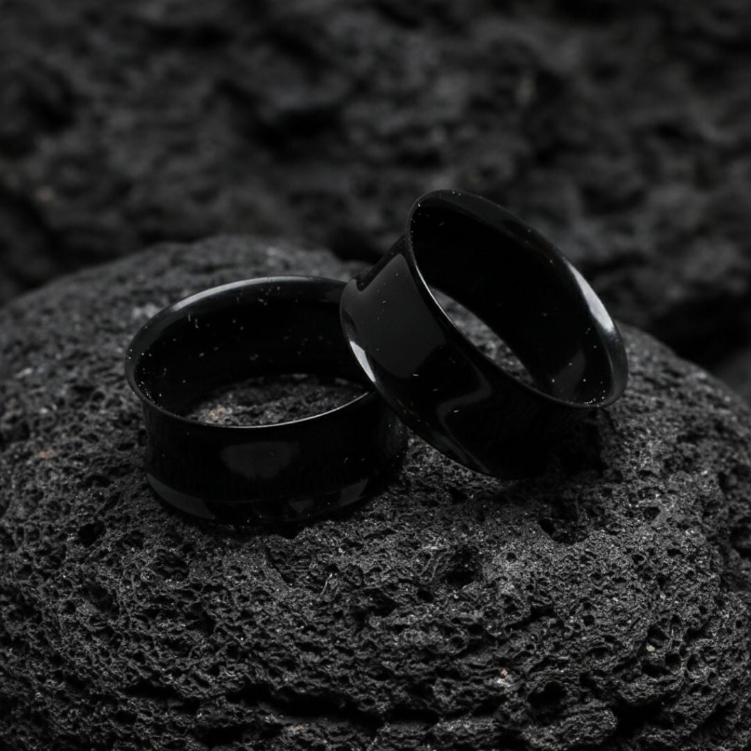 Pair of black PVD surgical steel tunnels for stretched ear lobes. Edgy alternative gauges ranging from small 12G to large 2 inch sizes.