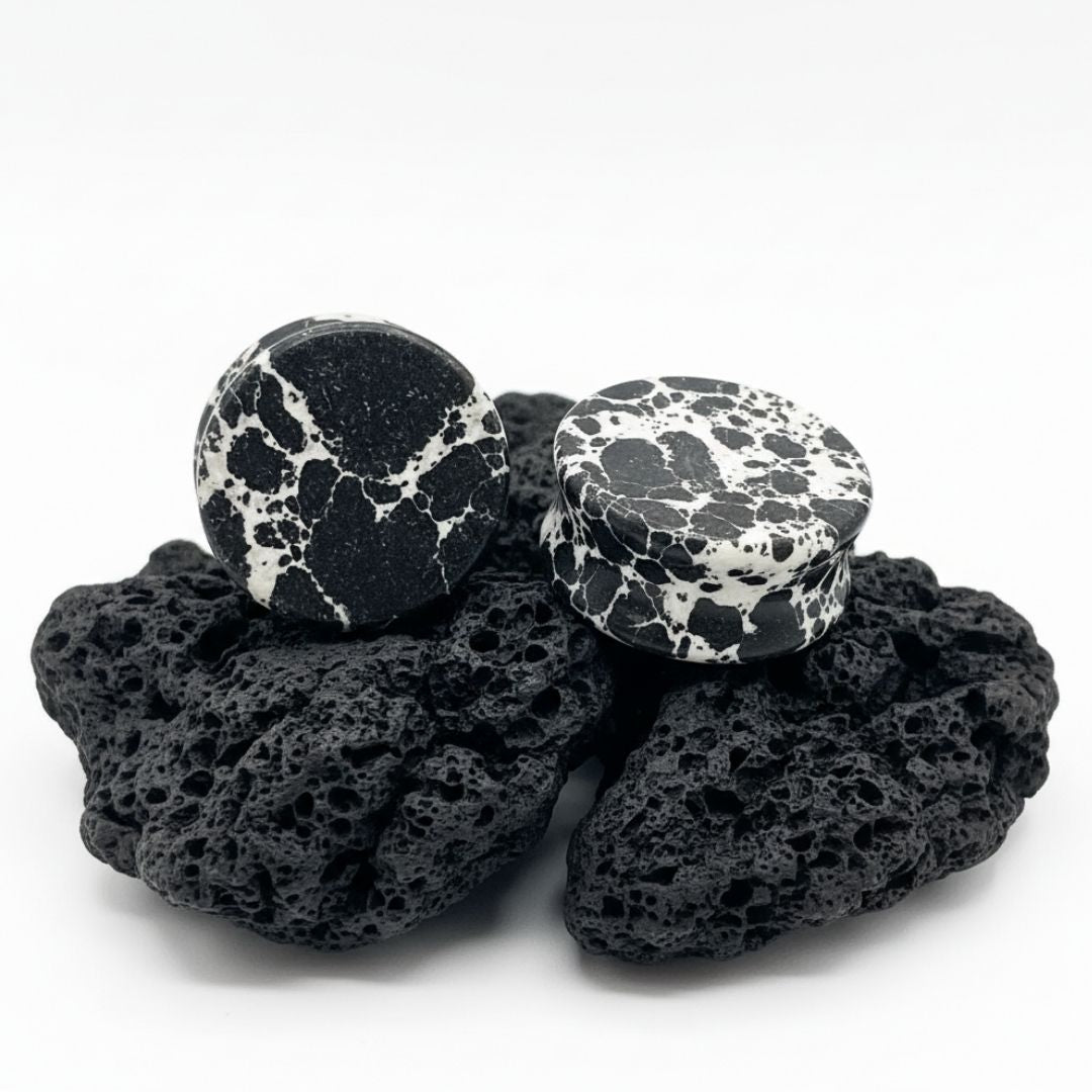 Close up photo of Black Imperial Turquoise stone plugs/gauges showing deep natural black matrix veins. Stretched ear jewelry.