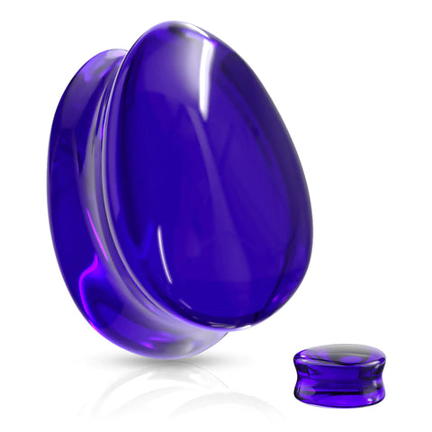 Blue Glass Teardrop Plugs reflecting light in a captivating manner