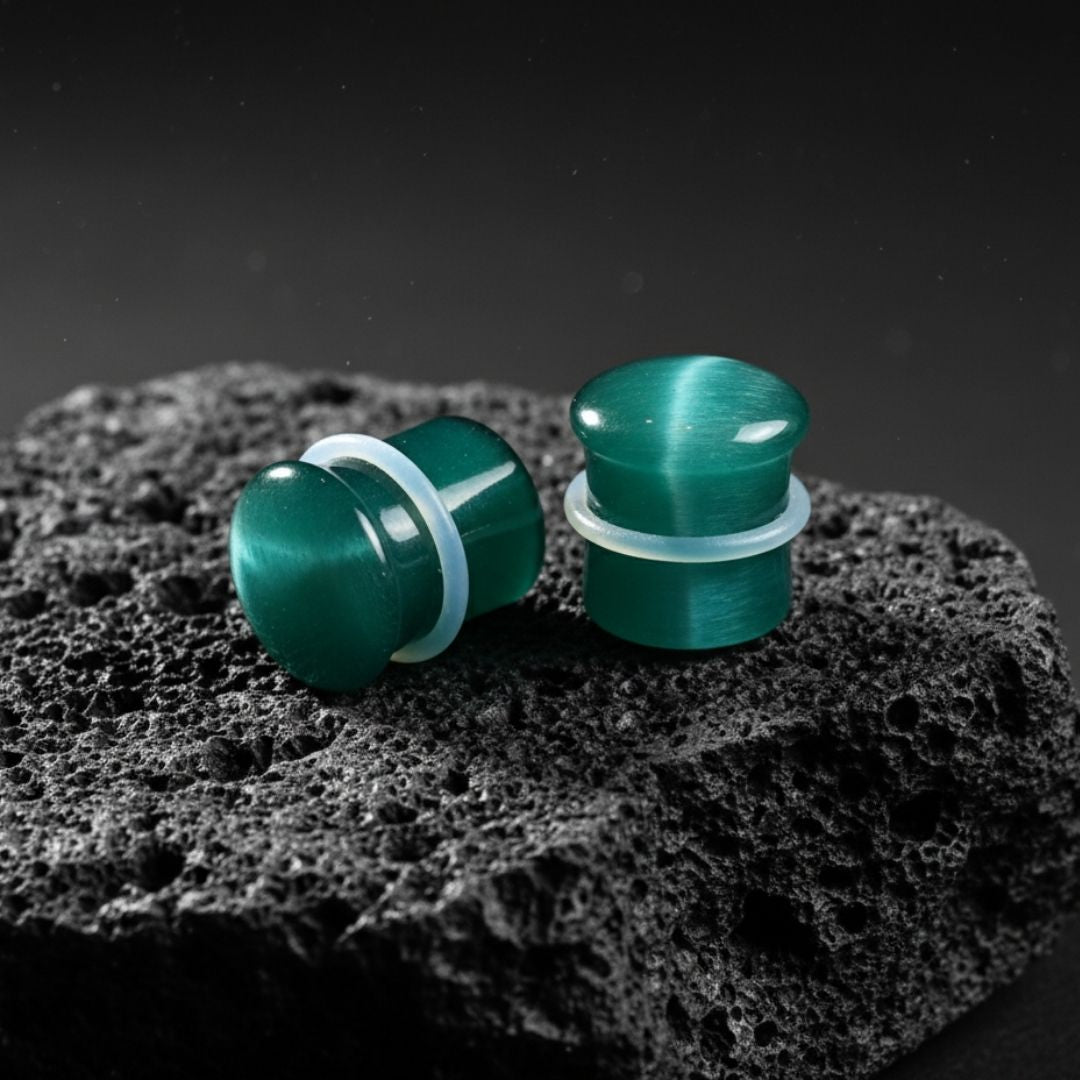 Emerald Dragon Eye plugs made from green Cat Eye Stone. Double flared stone gauges for stretched lobes, 4mm to 16mm.