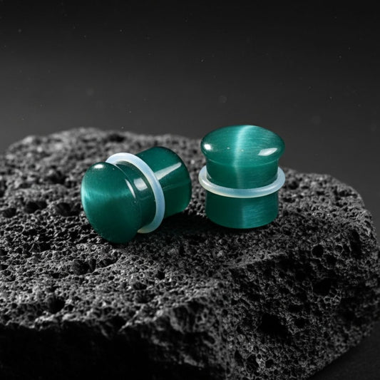 Emerald Dragon Eye plugs made from green Cat Eye Stone. Double flared stone gauges for stretched lobes, 4mm to 16mm.