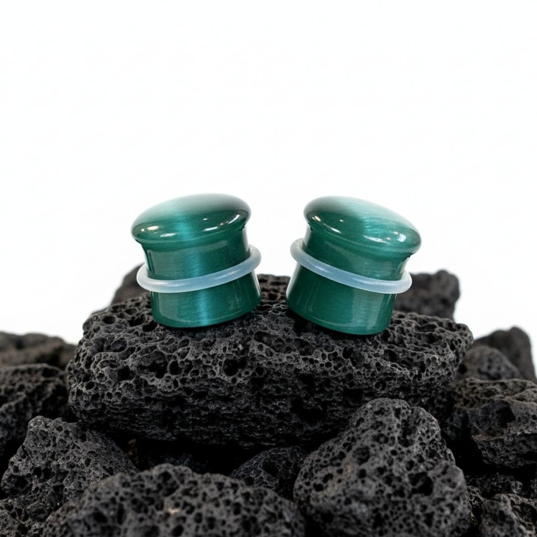 Emerald Dragon Eye plugs made from green Cat Eye Stone. Double flared stone gauges for stretched lobes, 4mm to 16mm.
