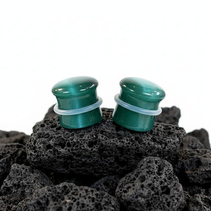 Emerald Dragon Eye plugs made from green Cat Eye Stone. Double flared stone gauges for stretched lobes, 4mm to 16mm.