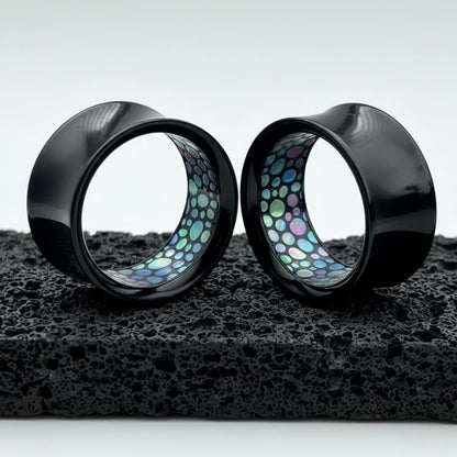black acrylic tunnels for stretched ears with a faux abelone inlay