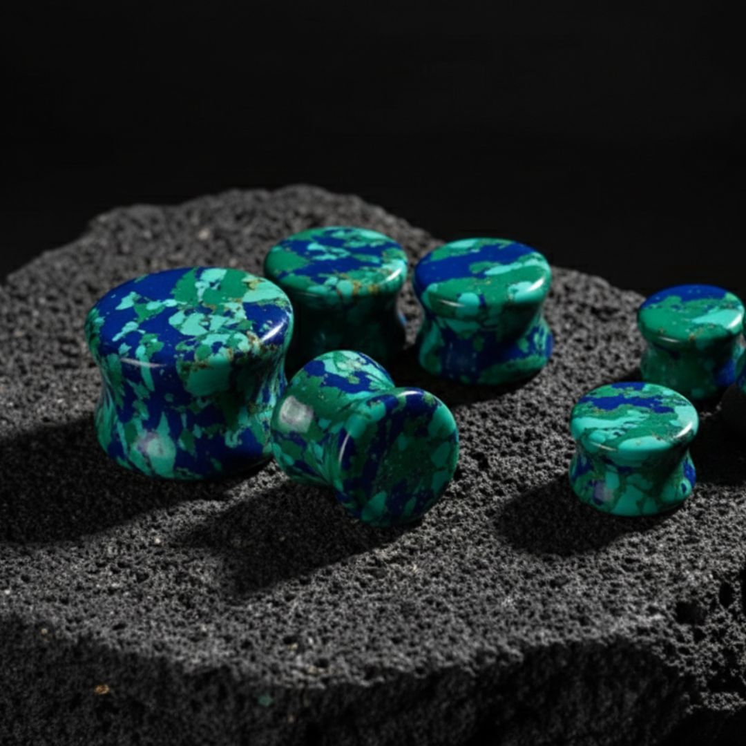 Pair of Gaia Turquoise Stone Plugs, showing distinct natural blue-green turquoise patterns and smooth polished surface, for stretched ears from 6mm to 16mm.
