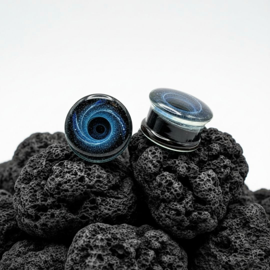 Pair of deep blue Galaxy Glass Plugs for stretched ears, ranging from 6mm (2G) to 25mm (1 inch). Alt style gauges.