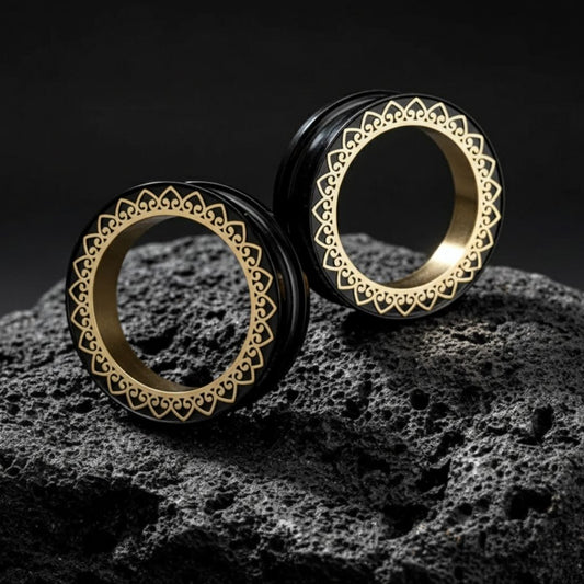 Pair of detailed stainless steel mandala tunnels (screw back plugs) for stretched ears, shown in 1 inch (25mm) size.