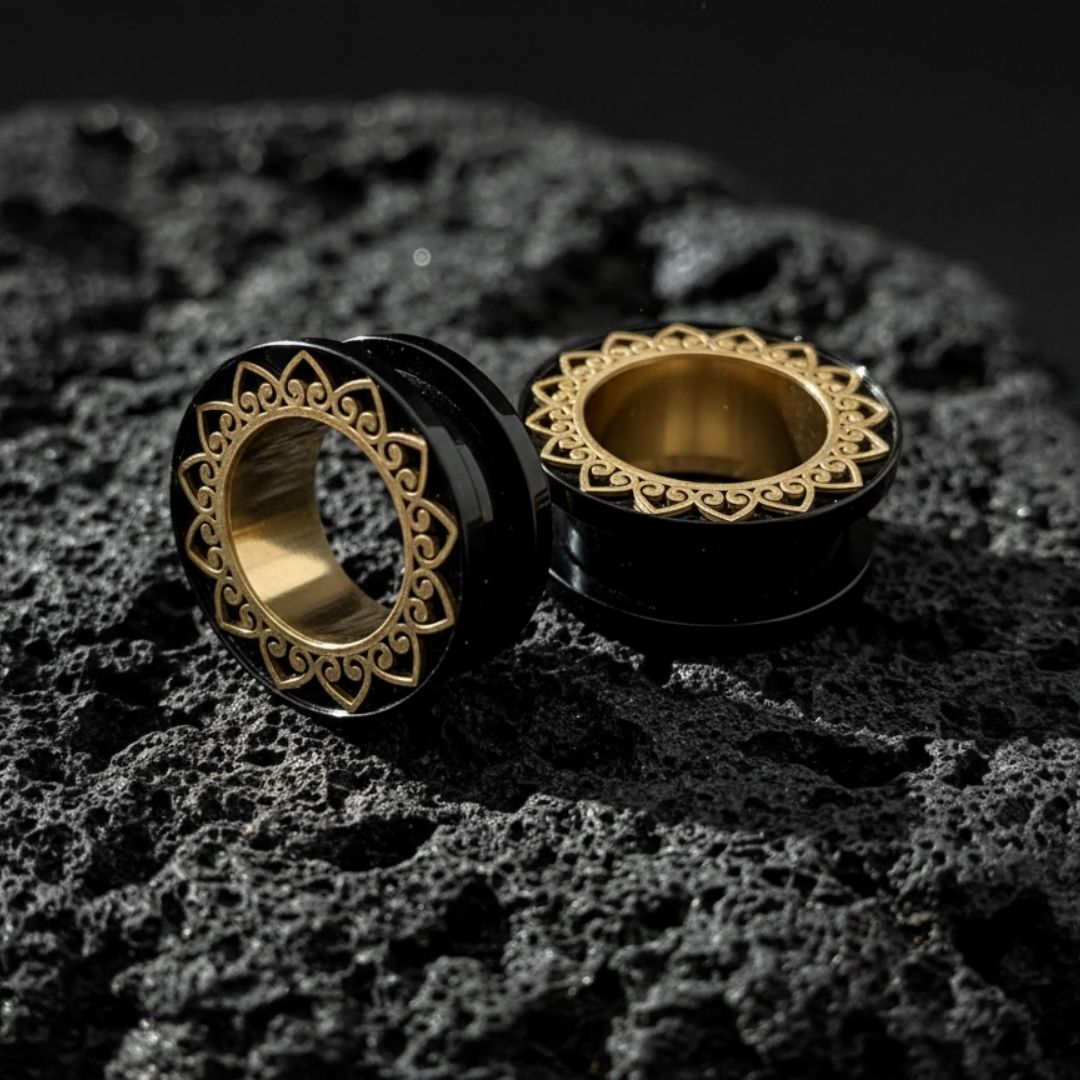 Pair of detailed stainless steel mandala tunnels (screw back plugs) for stretched ears, shown in 1 inch (25mm) size.