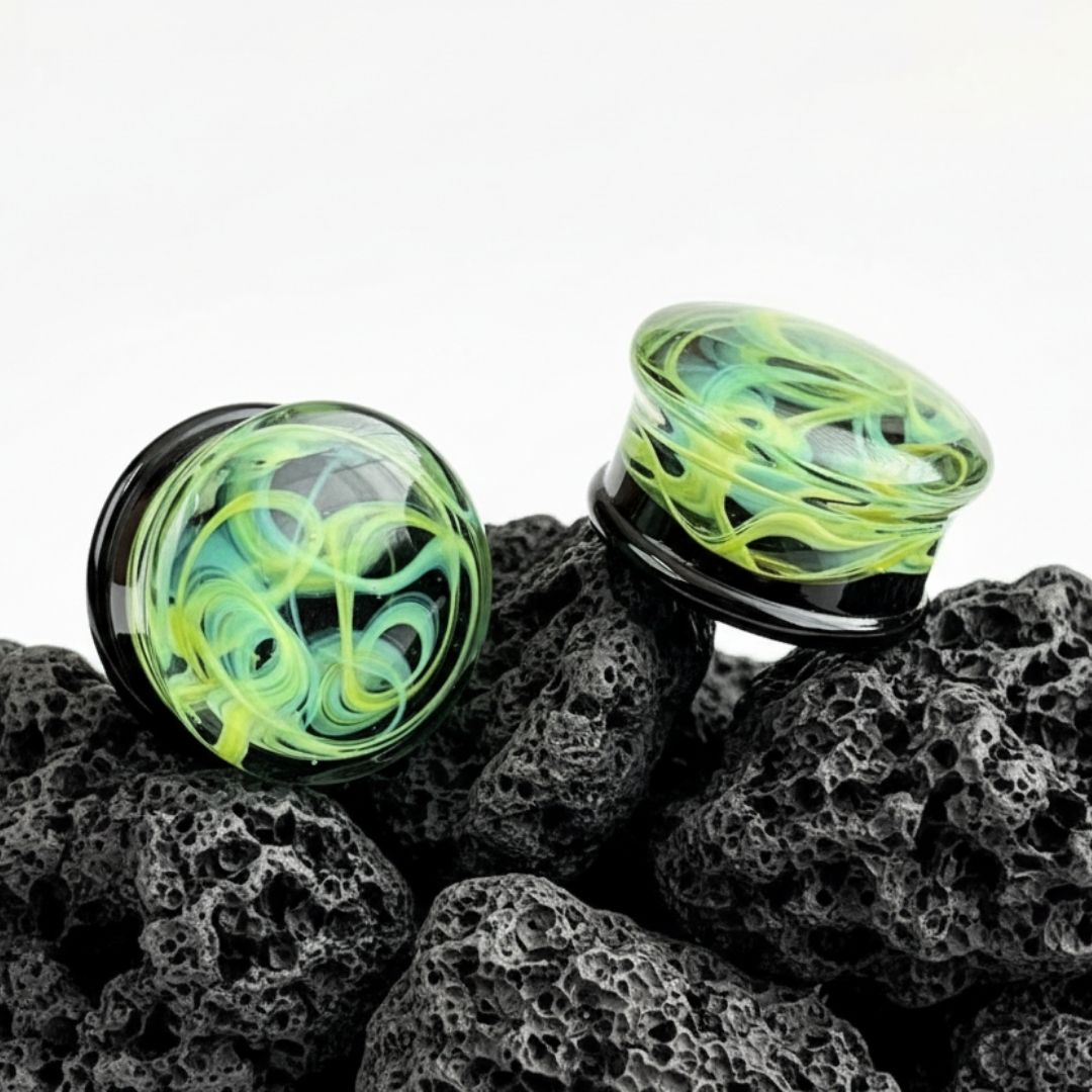 Pair of green vortex pattern glass plugs for stretched ears, gauges 6mm to 25mm, alt jewelry, unique piercing.