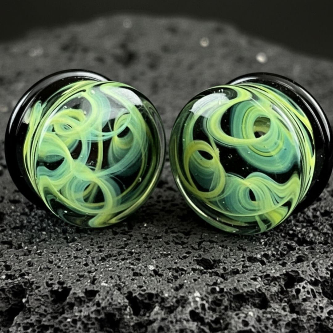 Pair of green vortex pattern glass plugs for stretched ears, gauges 6mm to 25mm, alt jewelry, unique piercing.