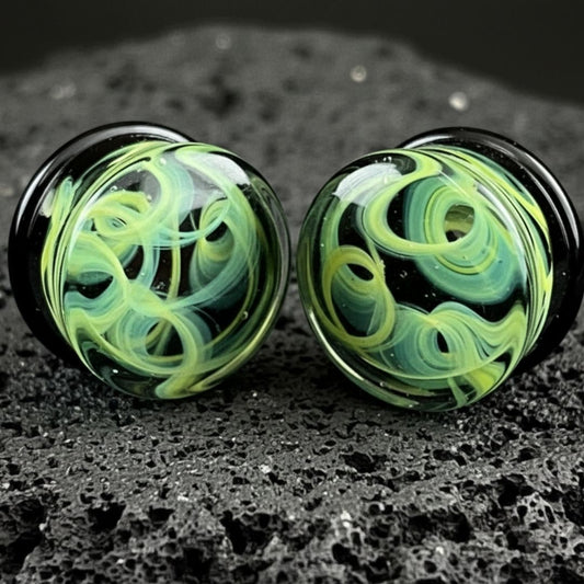 Pair of green vortex pattern glass plugs for stretched ears, gauges 6mm to 25mm, alt jewelry, unique piercing.