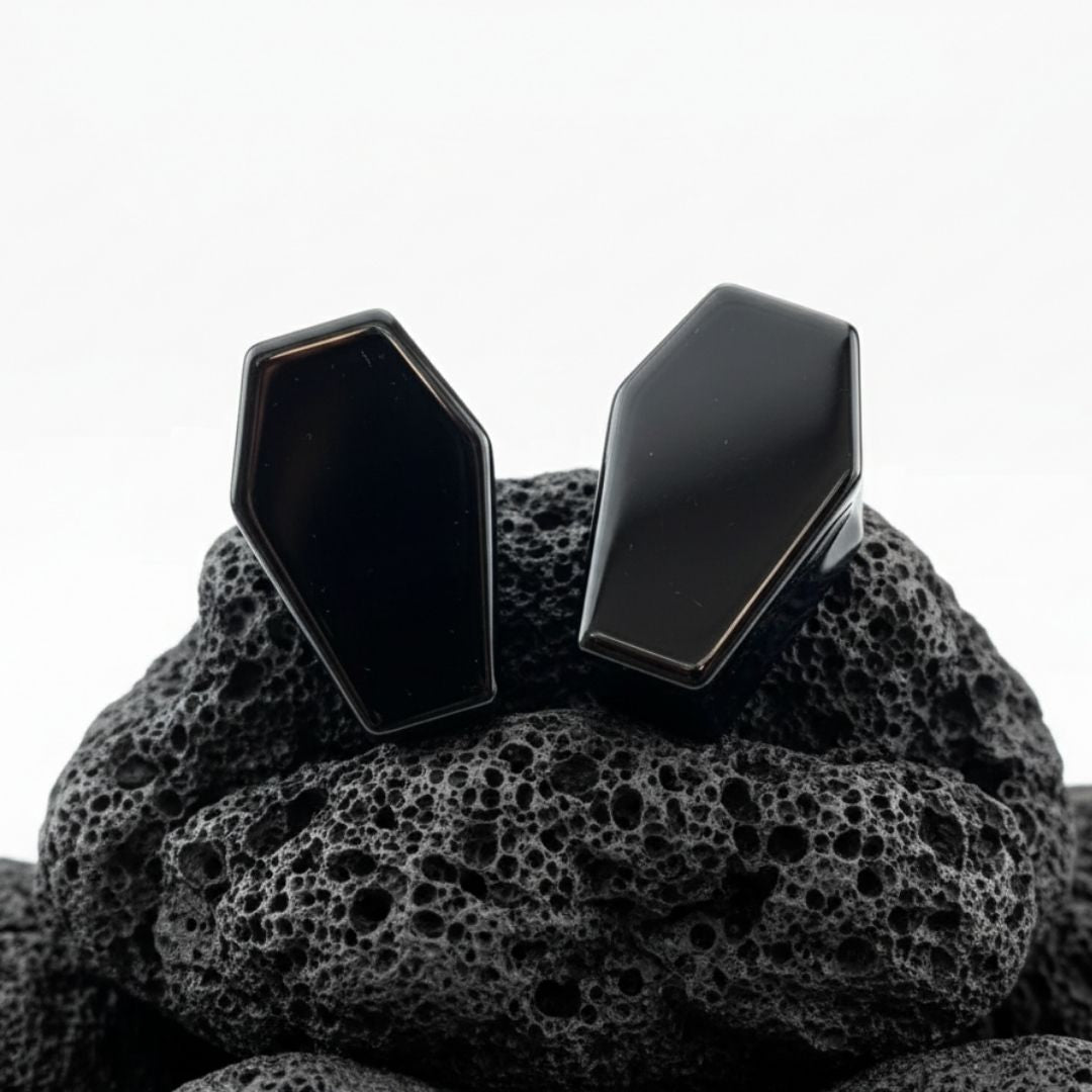 Pair of polished Black Obsidian Coffin Plugs for stretched ears. Dark, heavy stone gauges with an edgy shape, perfect for goth alt jewelry collectors.