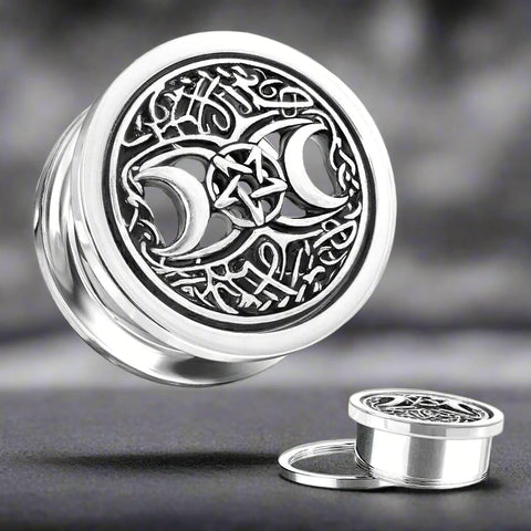 Silver plated plugs showcasing a detailed pentagram surrounded by crescent moons.