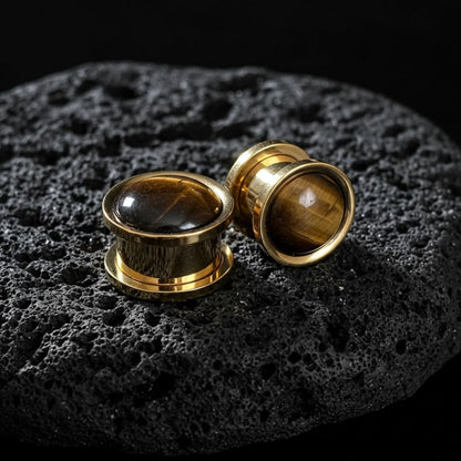 Pair of golden steel plugs with natural brown and gold Tigers Eye stone inlay. Stretched ear jewelry 6mm to 16mm.