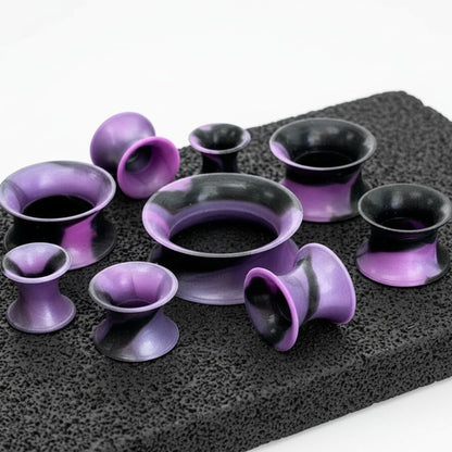 A pair of Purple Retro Silicone Skins (5mm-22mm) on stone, shot on a white background.