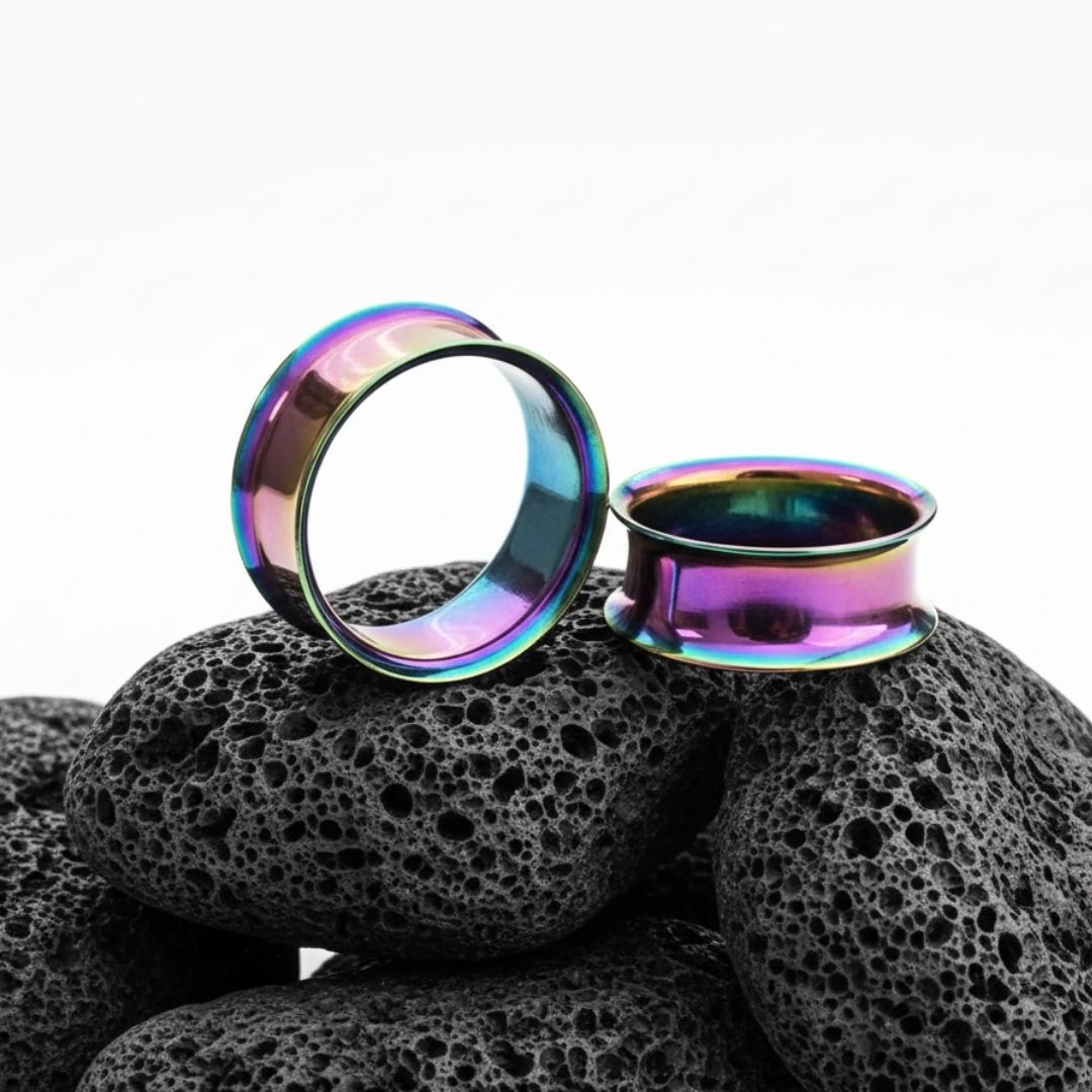 Pair of double flare steel tunnels with an iridescent rainbow finish for stretched lobes. Sizes 3mm to 25mm.