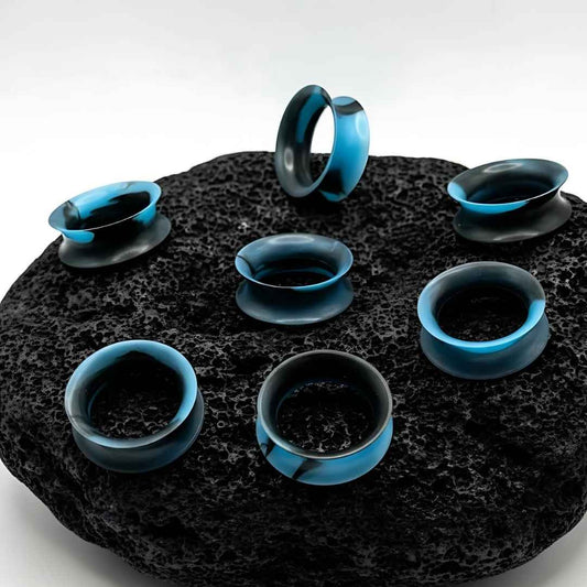 Retro Blue Marble Silicone Skins for stretched ears on dark stone