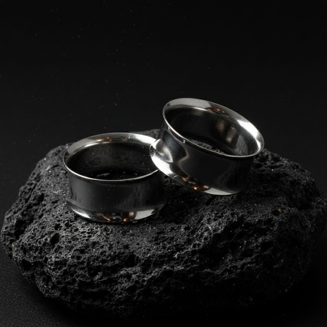 Pair of double flare surgical steel tunnels, showing the hollow center. Best gauges for stretched ear piercing culture.