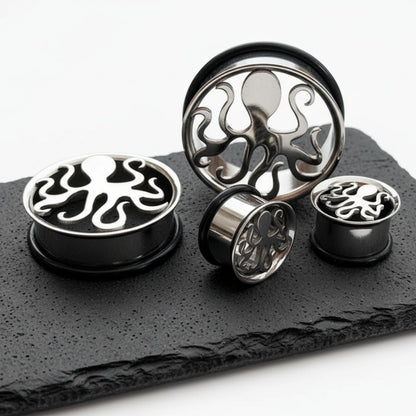 A pair of Steel Kraken Tunnels (6mm-30mm) shown on stone against a white background.