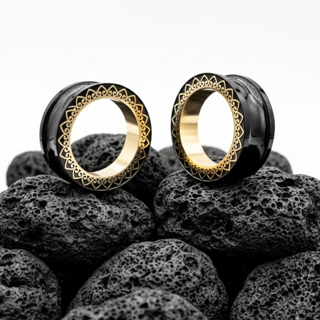 Pair of detailed stainless steel mandala tunnels (screw back plugs) for stretched ears, shown in 1 inch (25mm) size.