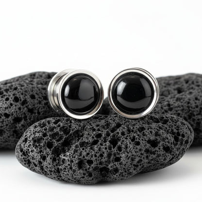 Pair of black onyx stone inlay plugs set into steel gauges (6mm - 16mm) for stretched ear piercings, alternative jewelry.