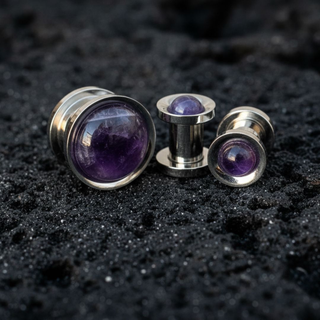 Steel Plugs Amethyst Inlay Gauges Tunnels On Dark Volcanic Stone