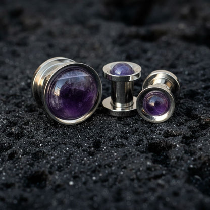 Steel Plugs Amethyst Inlay Gauges Tunnels On Dark Volcanic Stone