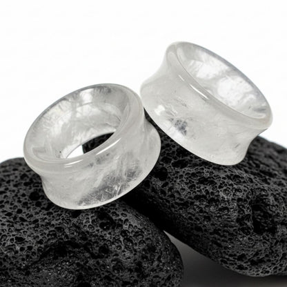 Icicle Quartz Tunnels for stretched ears on dark volcanic stone