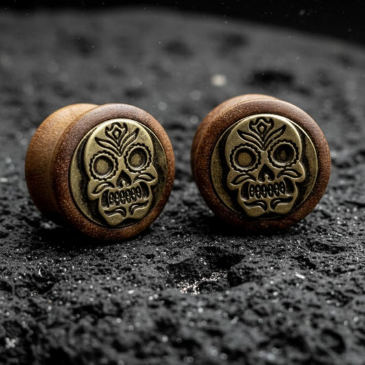 Pair of organic wood plugs carved with intricate Sugar Skull / Dia de Muertos design. Dark brown wood gauges 8mm-16mm.