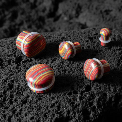 Psychedelic Stone Plugs in synthetic tie dye stone (6mm-16mm) on volcanic rock.