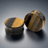 a pair of tigers eye stone plugs for stretched ears