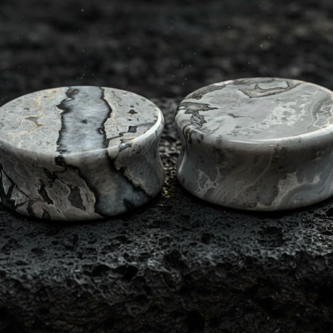 Pair of deep blue and grey Wave Jasper stone plugs, double flared, for stretched lobes in alternative fashion jewelry.