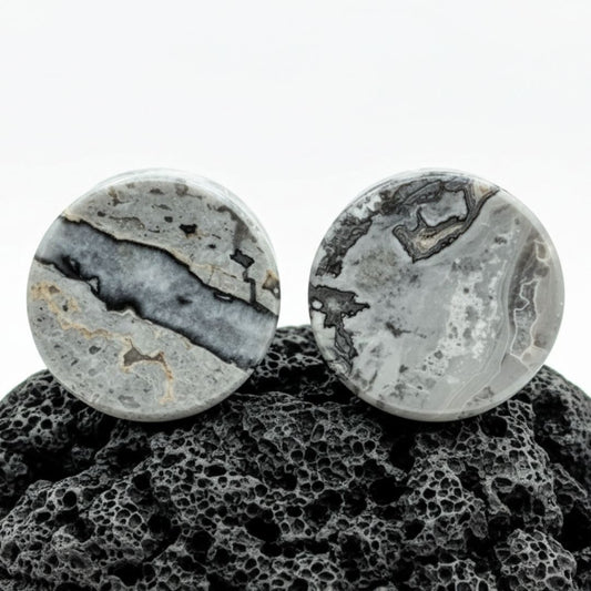 Pair of deep blue and grey Wave Jasper stone plugs, double flared, for stretched lobes in alternative fashion jewelry.