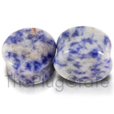 A pair of organic blue denim lapis stone plugs for stretched ears