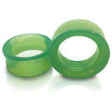 A pair of green opalite tunnels for stretched ears