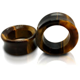 A pair of tigers eye stone tunnels for stretched ears