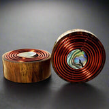 a pair of sono wood wire plugs for stretched ears